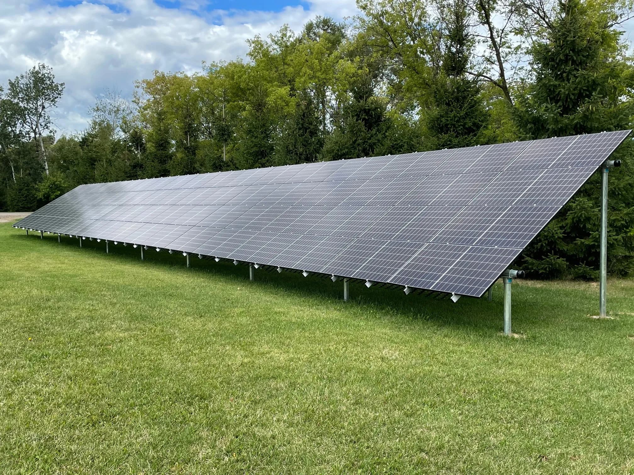 Ground-mounted residential solar panel system providing clean renewable energy